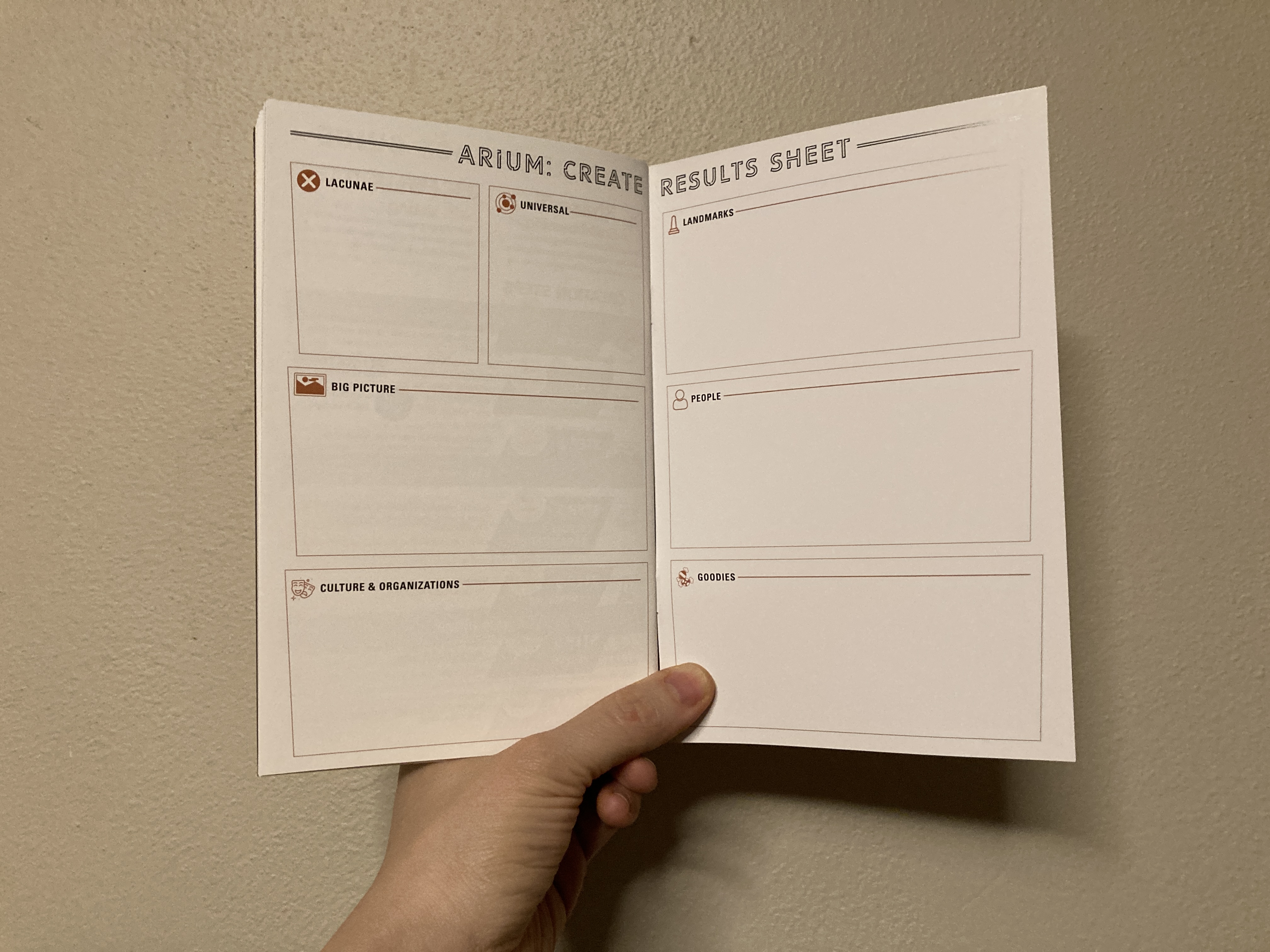 Photo of page spread showing the Results Sheet in Arium: Create